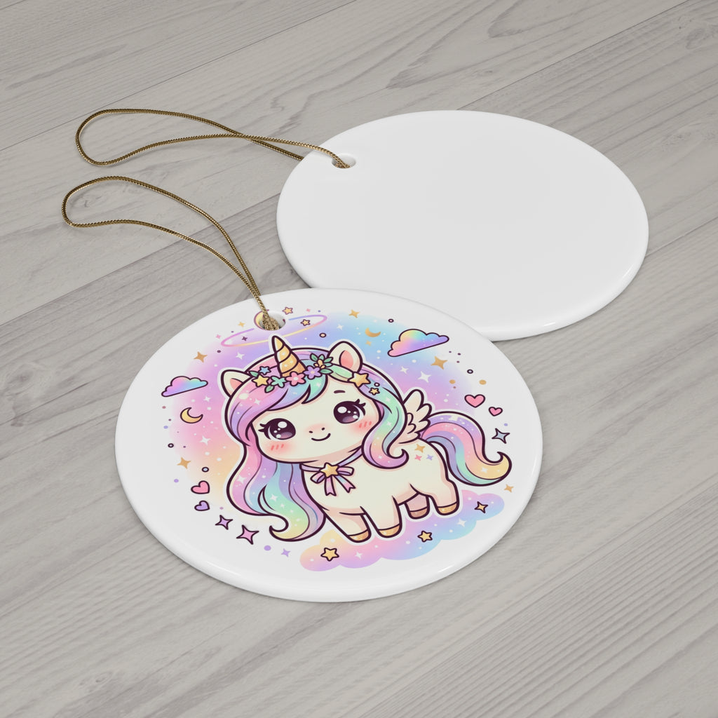 Two round white ceramic ornaments on a light gray wood background. The front ornament features a colorful illustration of a cute pastel unicorn with a rainbow mane, horn, and wing, surrounded by stars and clouds.