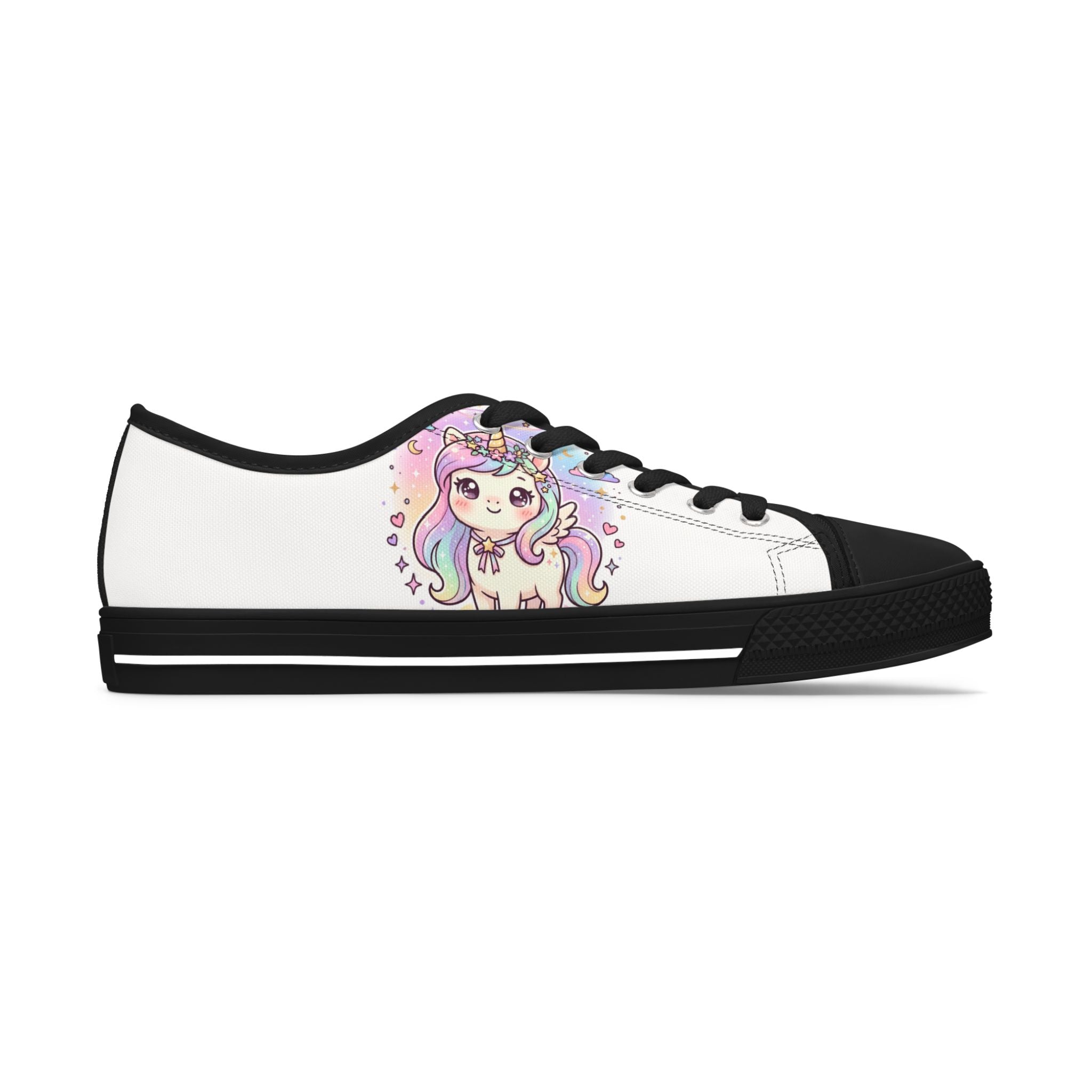 A low-top canvas sneaker with a white upper, black toe cap, black laces, and a black sole, featuring a colorful cartoon unicorn graphic on the side.
