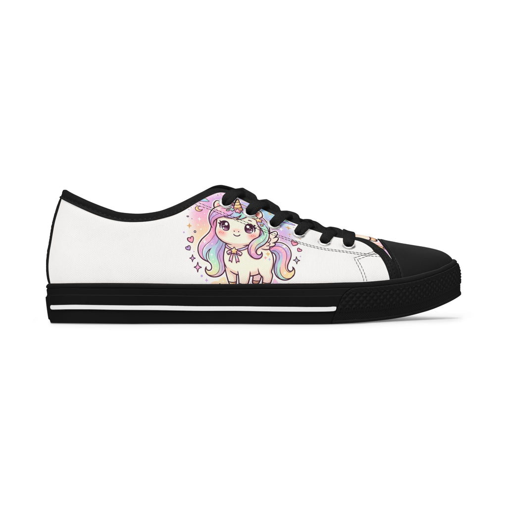 A white low-top canvas sneaker with a black rubber toe cap, black laces, and a black sole, featuring a colorful cartoon unicorn graphic printed on the side.