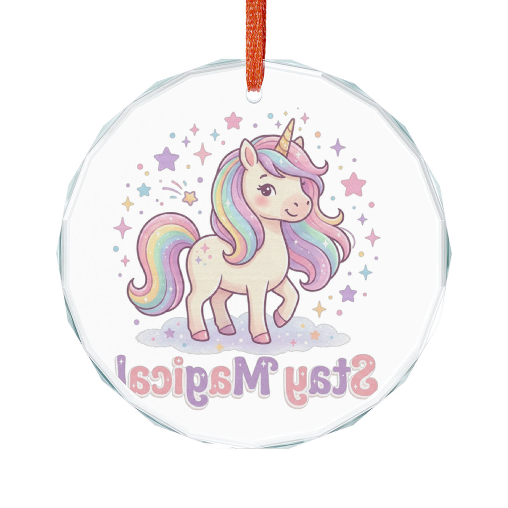 Round clear acrylic hanging ornament with a colorful cartoon unicorn illustration, pastel stars, and the word 'Stay Magical' in pink and purple lettering, suspended by an orange ribbon on a white background.