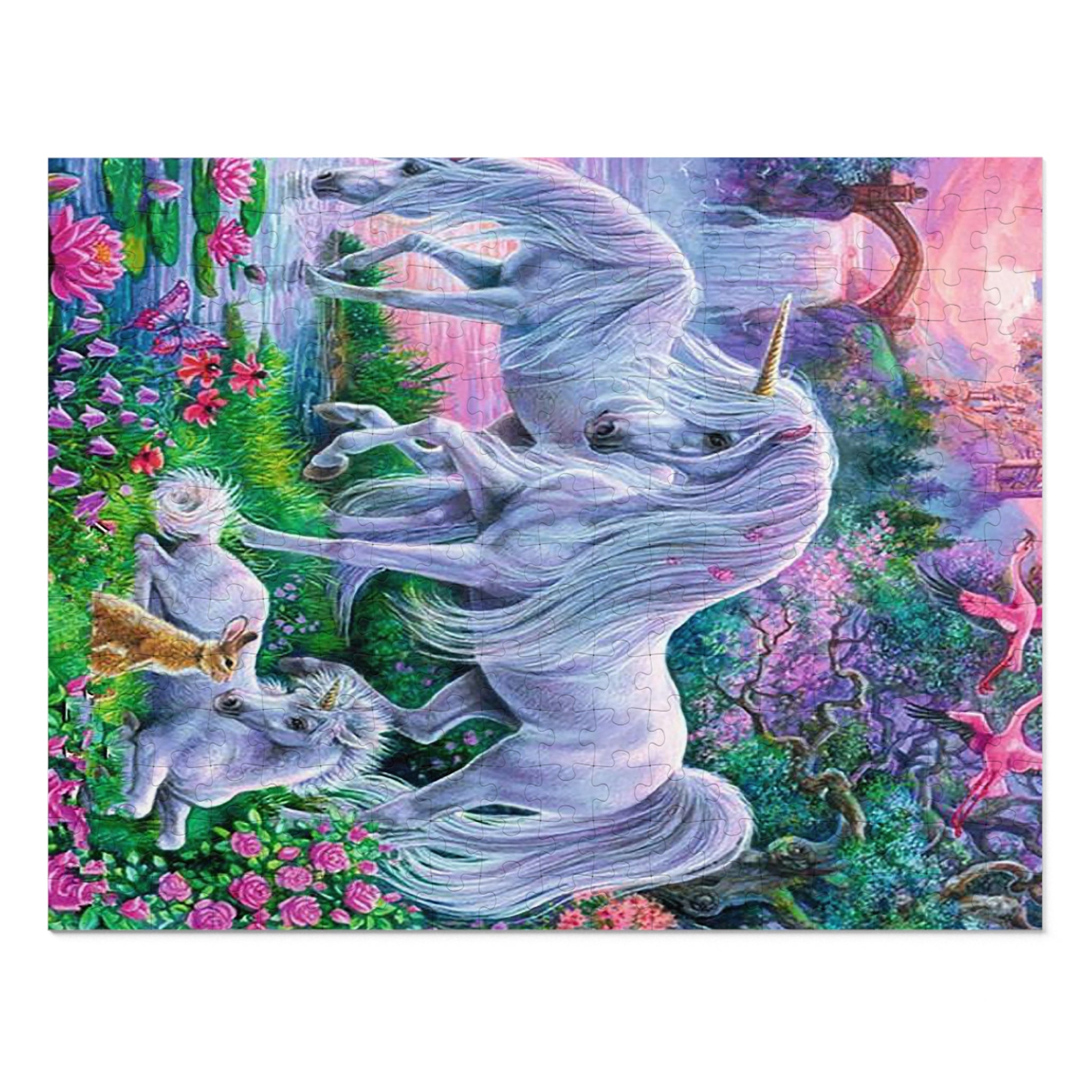 A colorful fantasy art print or puzzle featuring a large white unicorn rearing up in a lush garden with smaller white animals and pink flowers. The artwork fills most of the frame against a white background.