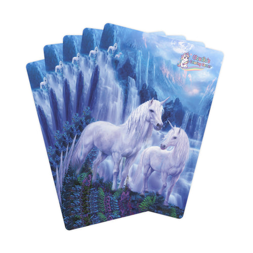 A fan of fantasy playing cards featuring two white unicorns in front of a blue icy waterfall landscape. The top card displays a logo for 'Kandis Magic Cards'.