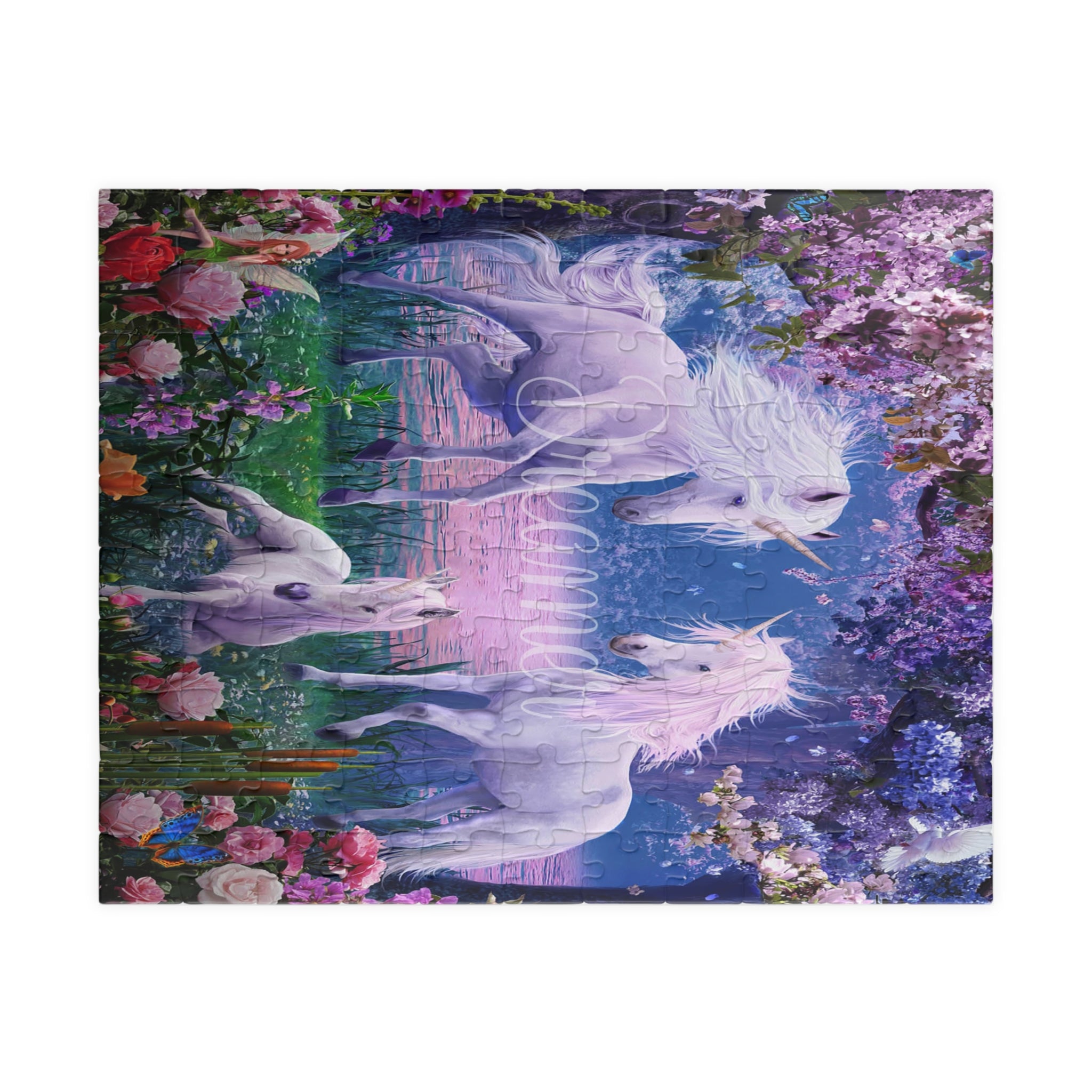 A completed jigsaw puzzle featuring a whimsical fantasy scene of three white unicorns in a reflective blue pond, surrounded by colorful flowers and green foliage, shown against a plain white background.