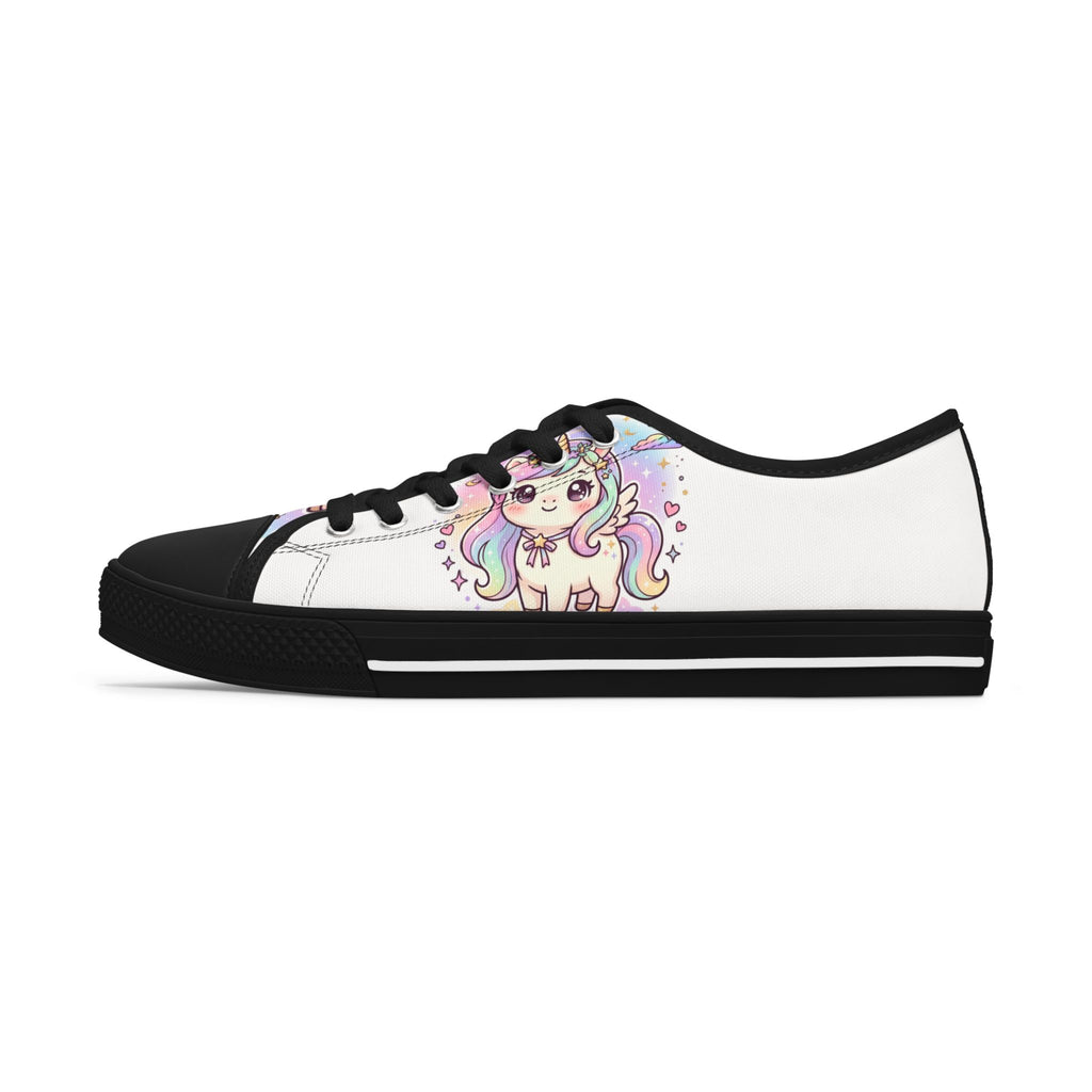 A low-top white canvas sneaker with a black rubber toe cap, black laces, and a colorful cartoon unicorn graphic printed on the side.